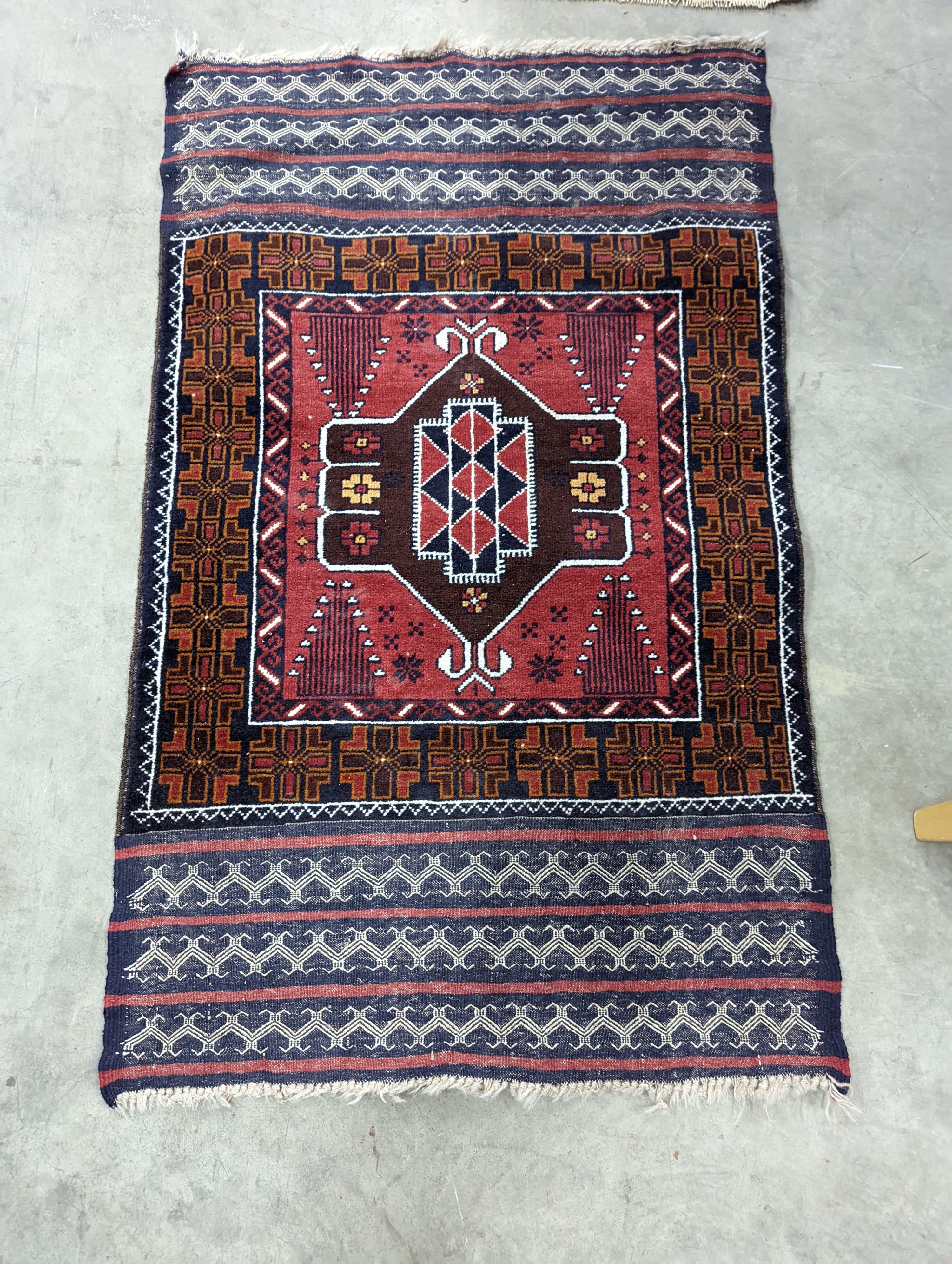 A Belouch geometric prayer rug and two Caucasian design rugs, largest 152 x 104cm